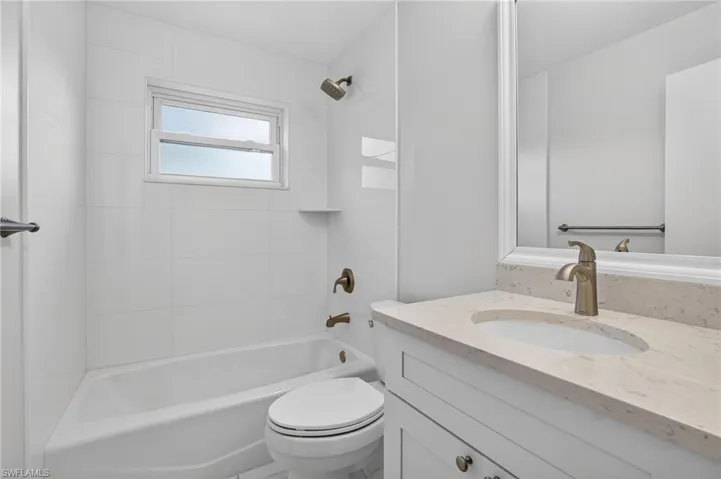 Guest Bathroom with vanity and tub / shower combination