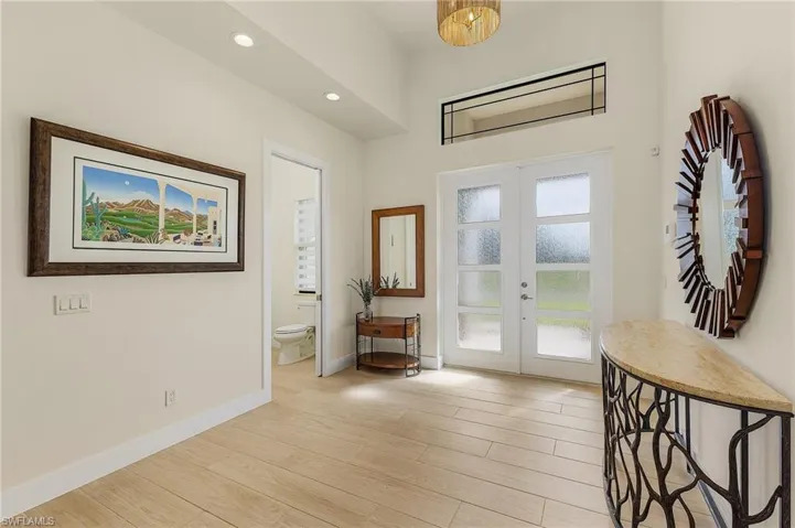 Foyer featuring french doors and tile flooring