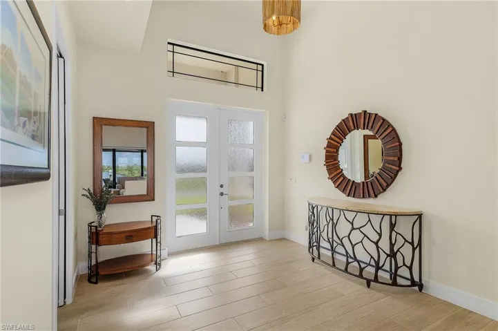 Foyer entry featuring french doors and tile flooring