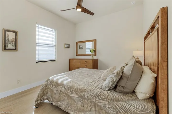 Bedroom with tile flooring and ceiling fan