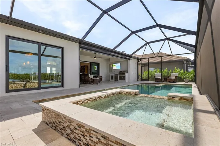 Pool and spa, screen enclosure, covered lanai