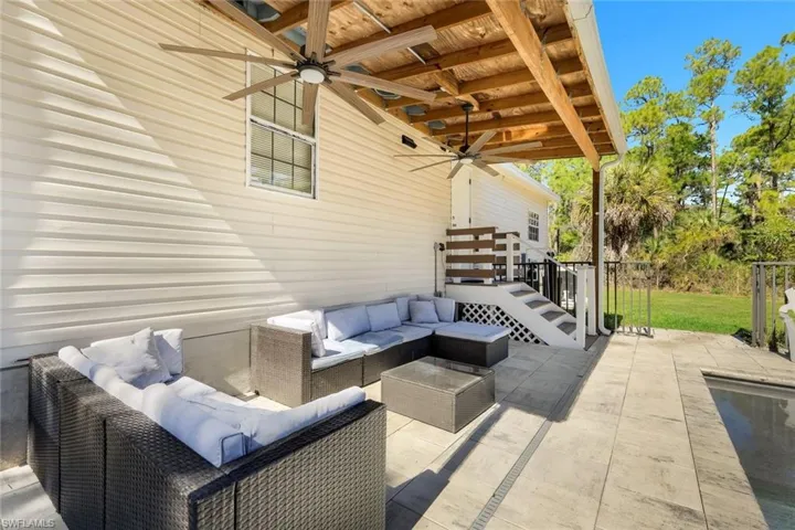 View of patio featuring ceiling fan and an outdoor hangout area