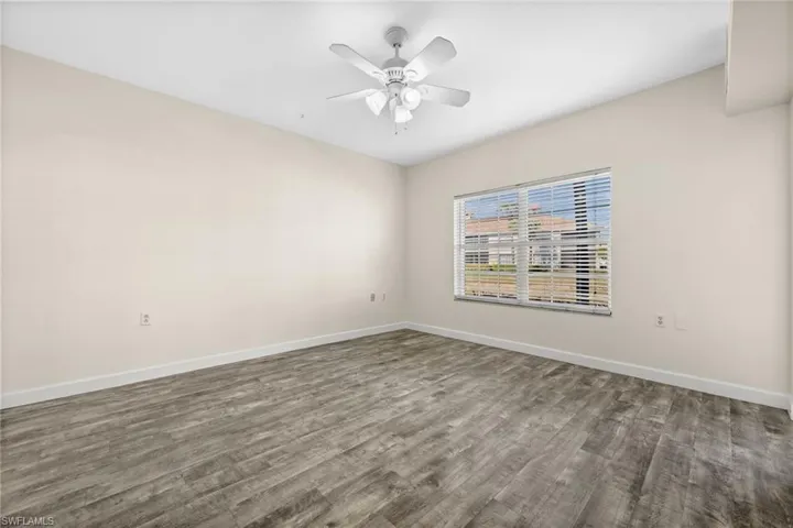Primary bedroom with lake views and lanai access