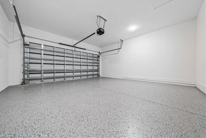 Garage featuring a garage door opener