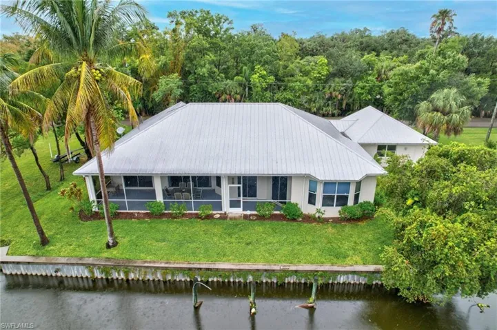 BACK OF HOUSE WITH SEA WALL