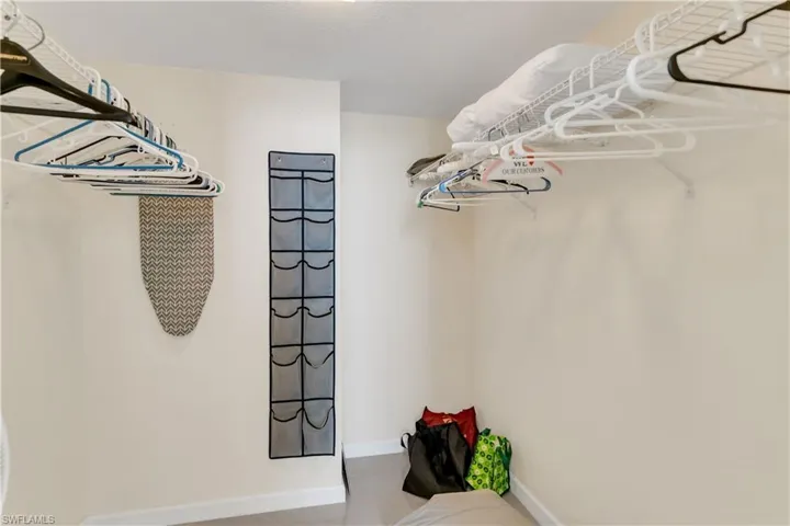 Walk in closet in bedroom.