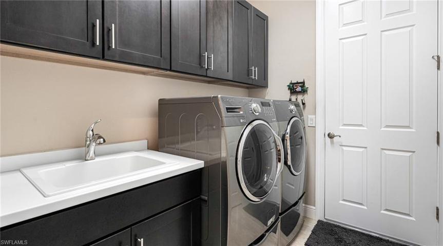 Laundry room with cabinets