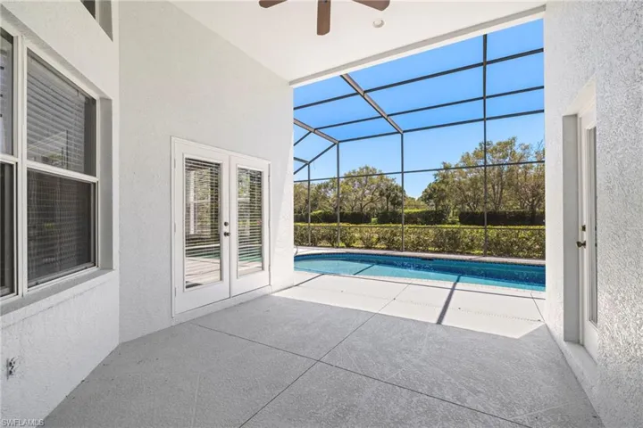 View of pool featuring ceiling fan, french doors, and a patio area