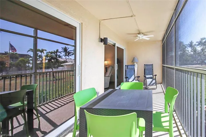 Sunroom / solarium with a ceiling fan