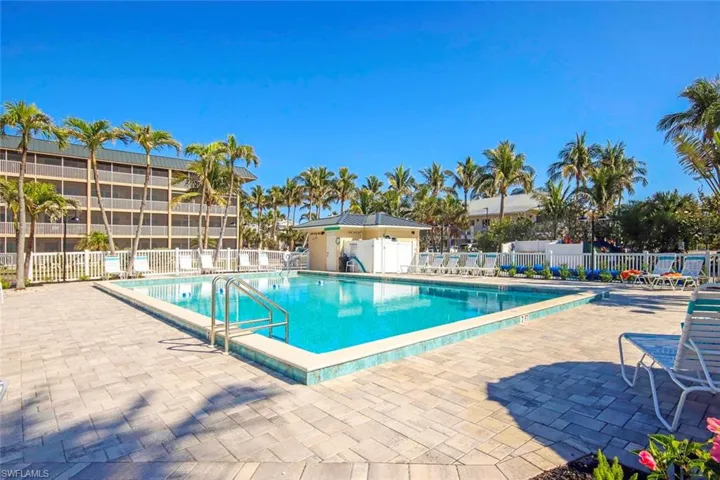 Pool featuring a patio area and fence