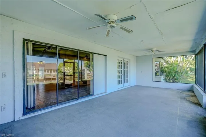 View of patio featuring ceiling fan