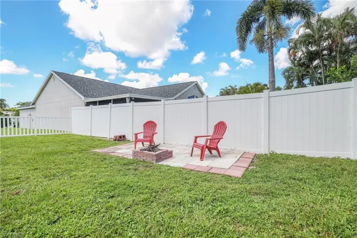 View of yard featuring a patio area and a fire pit