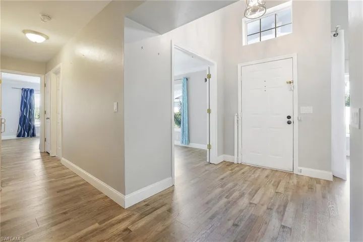 Entrance foyer featuring light wood-type flooring and a wealth of natural light