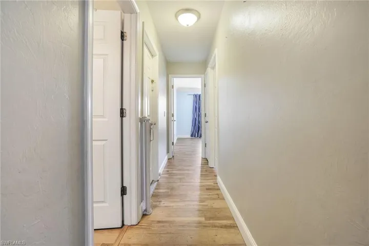 Hall featuring light wood-type flooring
