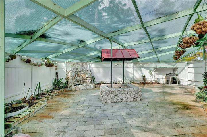 Bonus enclosed and screened area with waterfall