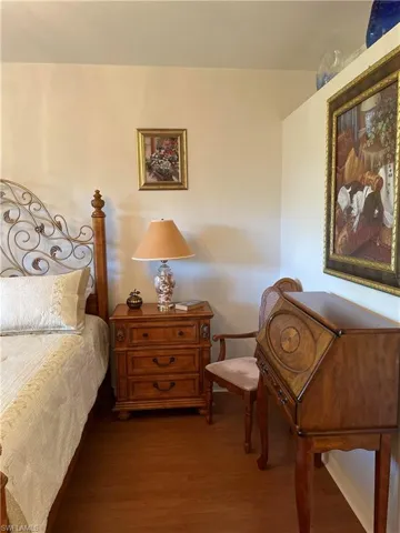 Bedroom featuring dark wood-type flooring