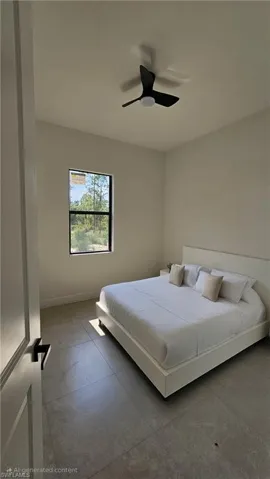 Bedroom featuring baseboards and a ceiling fan