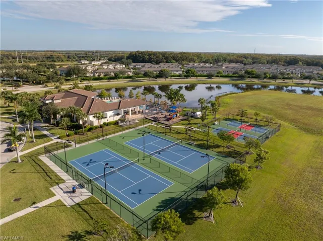 Aerial perspective of suburban area with a large body of water