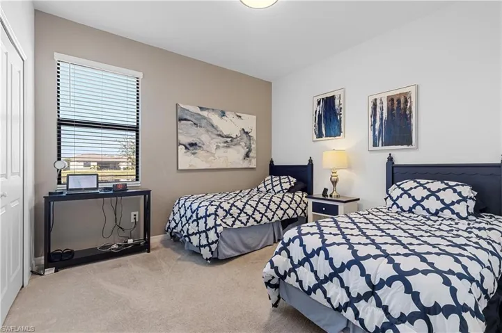 Bedroom 2 with a closet and carpet floors