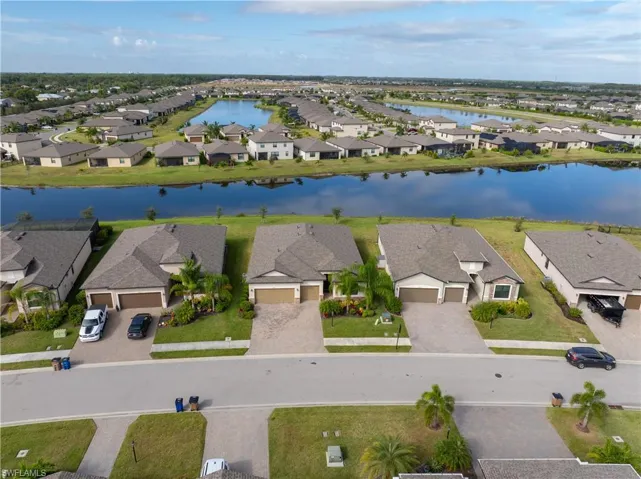 Aerial view of residential area with a nearby body of water