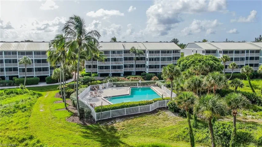 View of swimming pool with a yard and a patio area