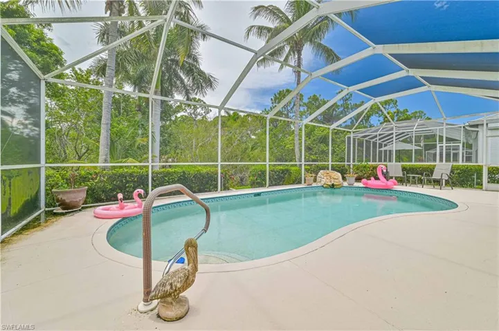 View of pool with a lanai and a patio area
