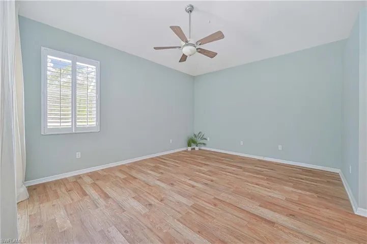Spare room featuring ceiling fan and light hardwood / wood-style flooring