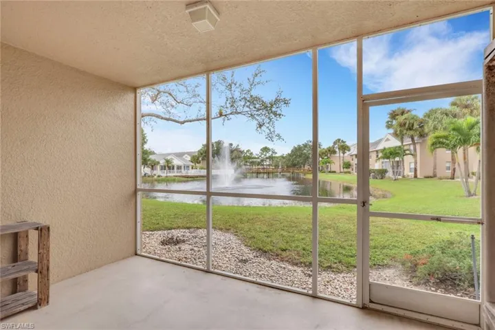 Unfurnished sunroom featuring a water view
