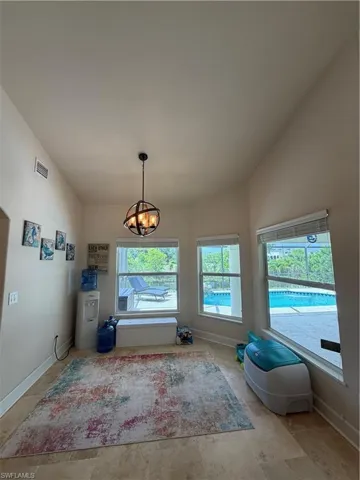 Eat in dining area with nice light fixture.