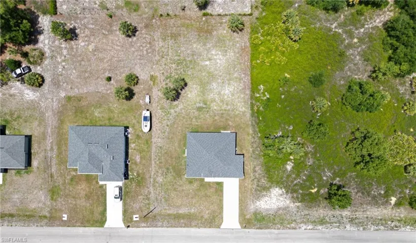 Vacant land parcel featuring established natural vegetation and a clear perimeter