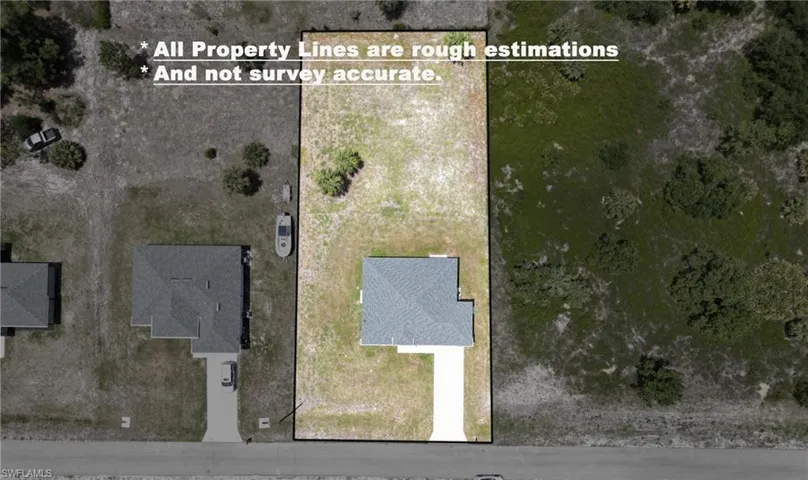Aerial view of a rectangular lot featuring a single-story residence with a light gray shingle roof and a concrete driveway