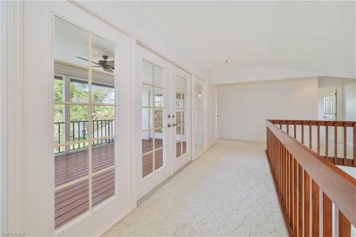 Hall featuring recessed lighting, carpet, and french doors