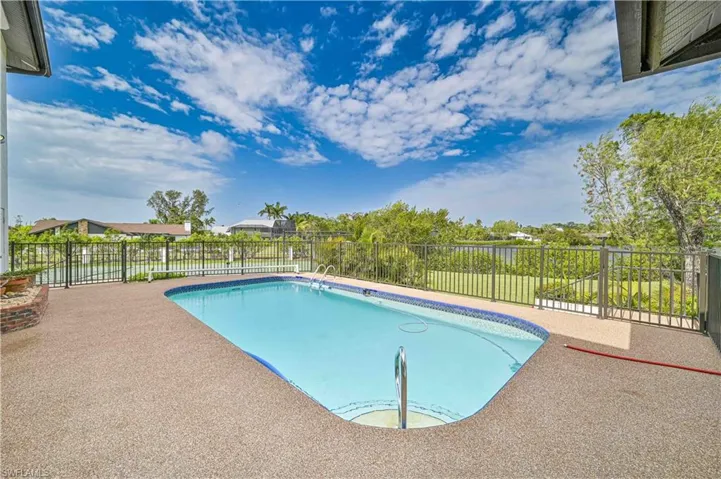 View of swimming pool featuring a fenced in pool, a patio area, and a fenced backyard