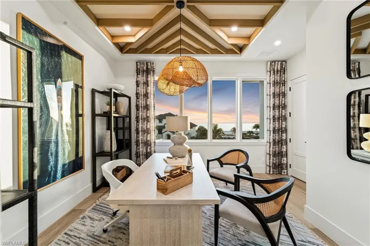 Office area with coffered ceiling, beamed ceiling, light wood-style flooring, and recessed lighting
