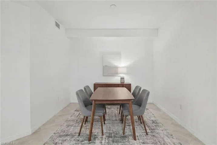 Dining room with baseboardsVirtually staged