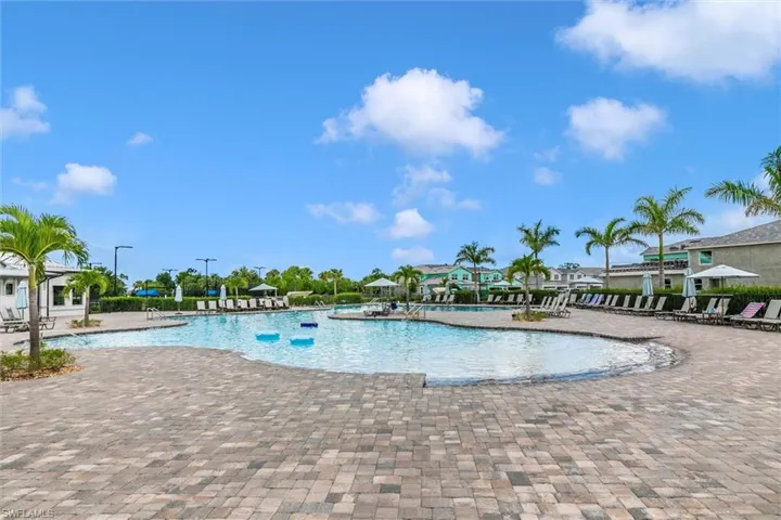 Community pool with a patio area