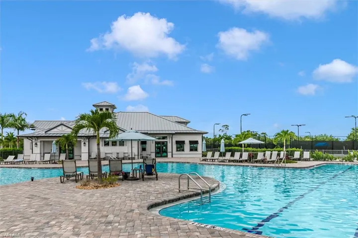 Community pool featuring a patio