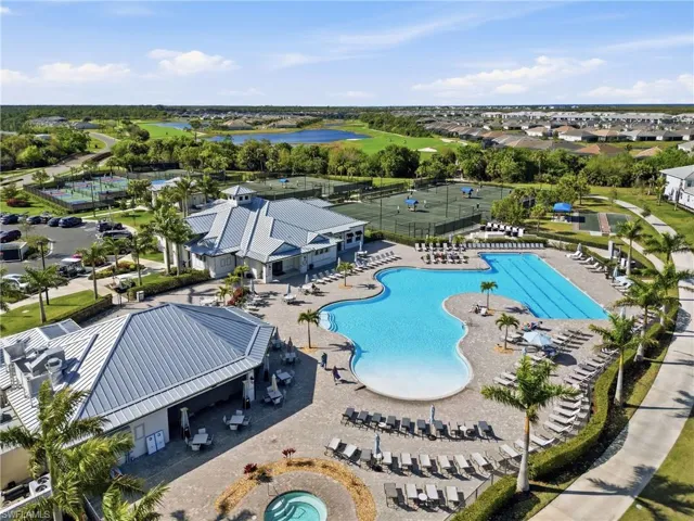 Community pool with a patio, a water view, and a residential view