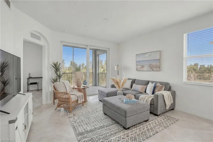 Living area featuring baseboardsVirtually staged