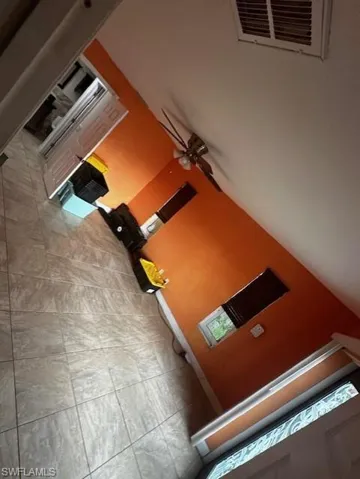 Room details featuring tile patterned floors and ceiling fan
