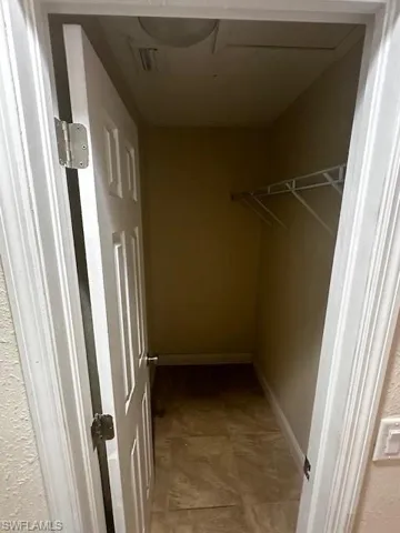 Spacious closet with tile patterned flooring