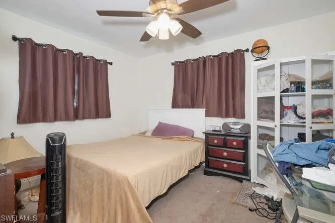 Bedroom with carpet flooring and ceiling fan