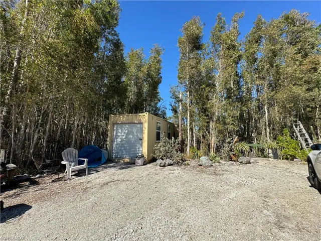View of yard with a storage unit