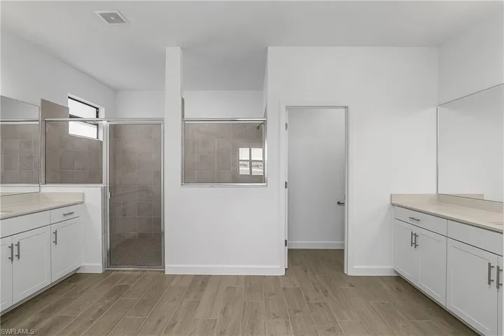 Owner bath is huge and includes walk-in shower and his/her vanities.