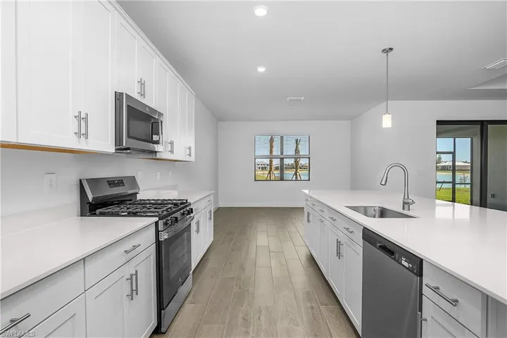 Kitchen includes family dining area with beautiful water views.