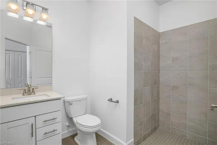 Guest bath features a walk-in shower.