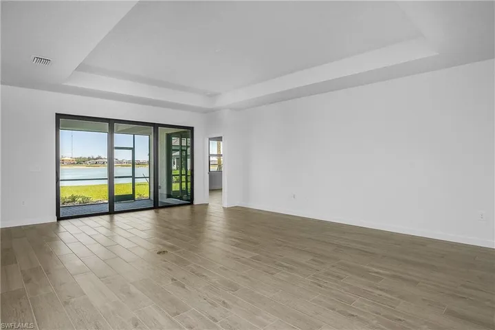 Open Great room with stunning long lake views New Construction close to amenities and entrance to community.