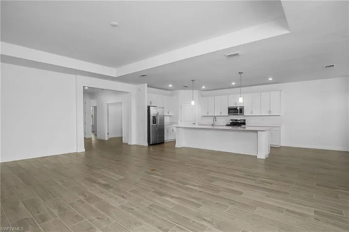Open floor plan with soaring ceilings and oversized great room.