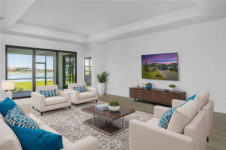 Open Great room with stunning long lake views New Construction close to amenities and entrance to community. (furnishings digitally staged)