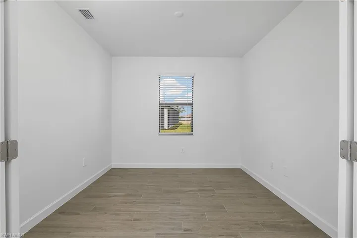 French doors leading into home office/den.